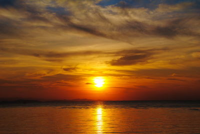 Scenic view of sea against romantic sky at sunset