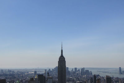 Buildings in city against sky