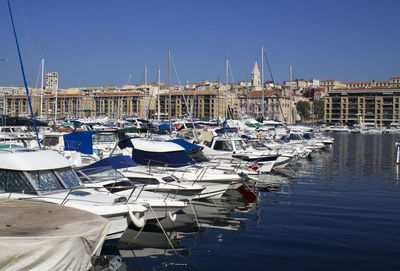 Boats moored at harbor