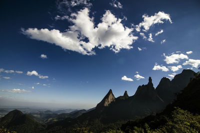 Scenic view of mountains against cloudy sky