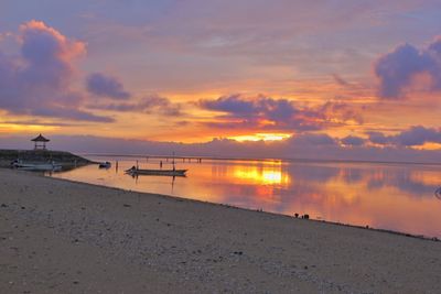 Scenic view of beach against sky during sunset