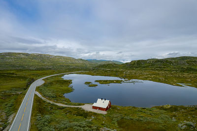 High angle view of road by mountains against sky