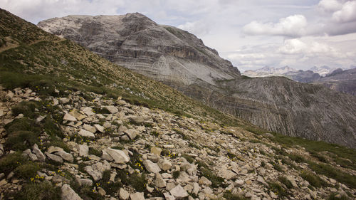 Scenic view of rocky dolomites mountains against sky