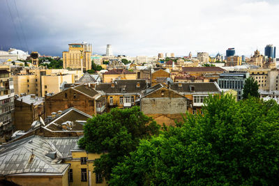 High angle view of residential district against cloudy sky