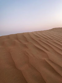 Scenic view of desert against clear sky