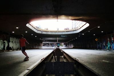 People walking in tunnel