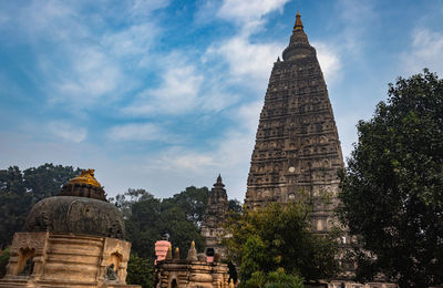 Mahabodhi temple buddhist stupas isolated with bright sky and unique prospective