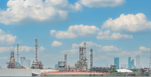 Oil refinery or petroleum refinery plant with blue sky background. power and energy industry. 