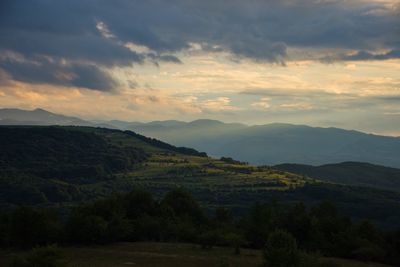 Scenic view of landscape against sky during sunset