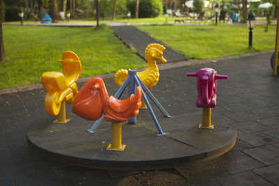 Close-up of toy on footpath in park