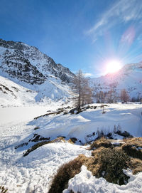 Scenic view of snowcapped mountains against sky