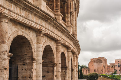 Low angle view of historical building against cloudy sky