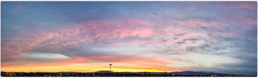 Scenic view of cloudy sky at sunset