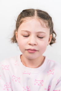 Close-up of cute girl at home