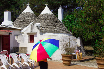 Multi colored umbrellas outside building