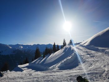 Panoramic view of snowcapped mountains against sky