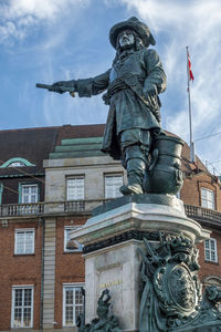 Low angle view of statue against sky