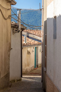 Narrow alley amidst buildings in town