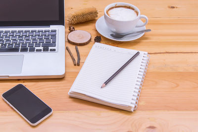 High angle view of coffee cup on table