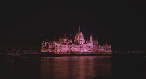 Illuminated city lit up at night