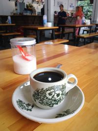 Coffee cup on table