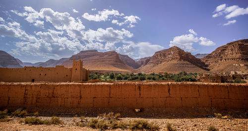 Panoramic view of land and mountains against sky