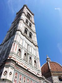 Low angle view of building against blue sky