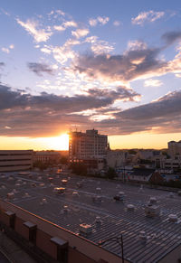 High angle view of buildings against sky during sunset