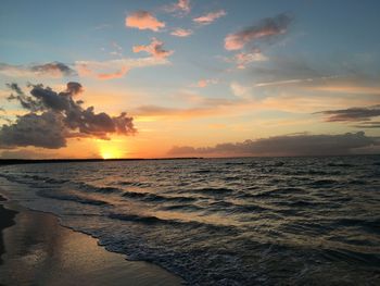 Scenic view of calm sea at sunset