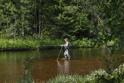 Man fishing in river