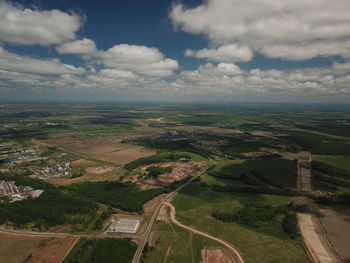 Aerial view of agricultural field against sky