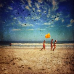 Woman jumping on beach