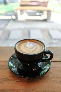 Coffee cup on table