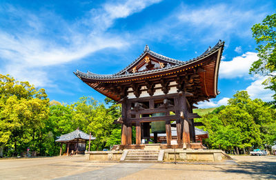 View of temple building against cloudy sky