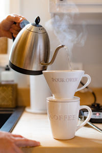 Hand holding coffee cup