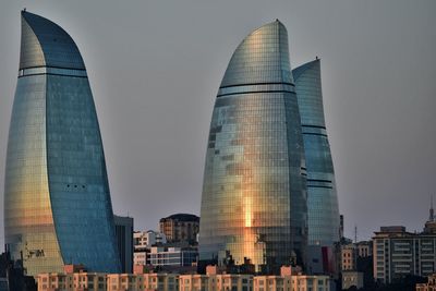 Low angle view of modern buildings against sky