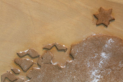 Close-up of gingerbread cookie dough on wooden table