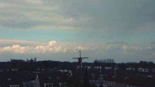 View of city against cloudy sky