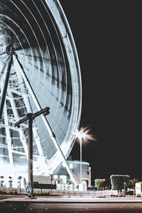 Low angle view of ferris wheel at night