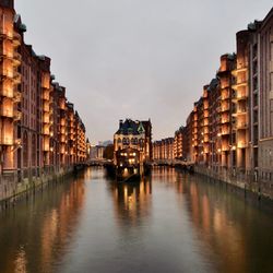 Canal passing through city buildings
