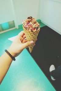 Cropped image of hand holding ice cream