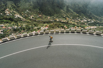 High angle view of man skateboarding on road
