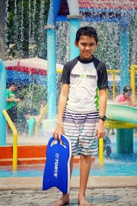 Portrait of a smiling young man in water