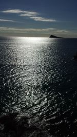 Scenic view of sea against sky at sunset