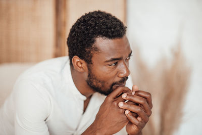 Portrait of young man looking away