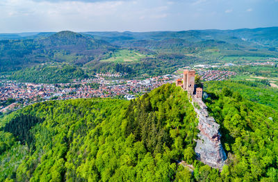 High angle view of green landscape against sky