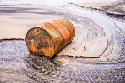 Rusty metal on shore at beach