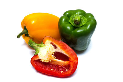 Close-up of bell peppers against white background