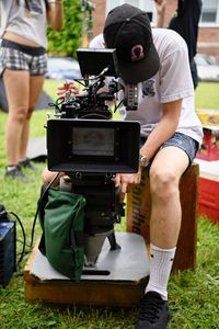 Low section of man photographing