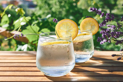 Cool lavender homemade lemonade with lemon slices and lavender flower. detox summer drink.